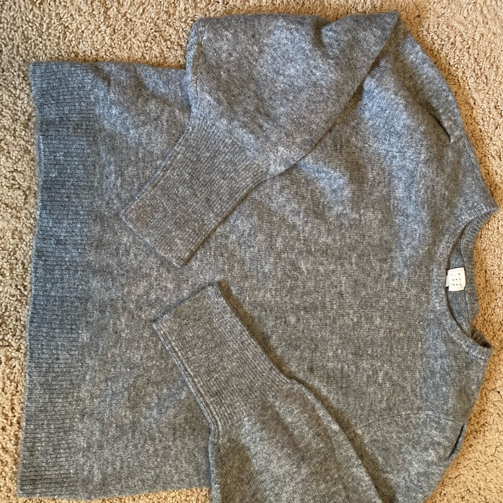 Gray lightweight sweater. No rips tears or stains